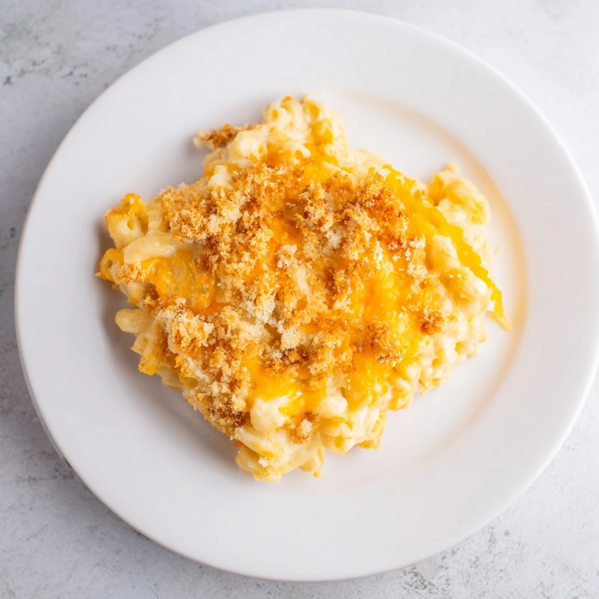 Golden, bubbly Old-Fashioned Baked Mac & Cheese with a crispy breadcrumb topping, perfect for dinner.