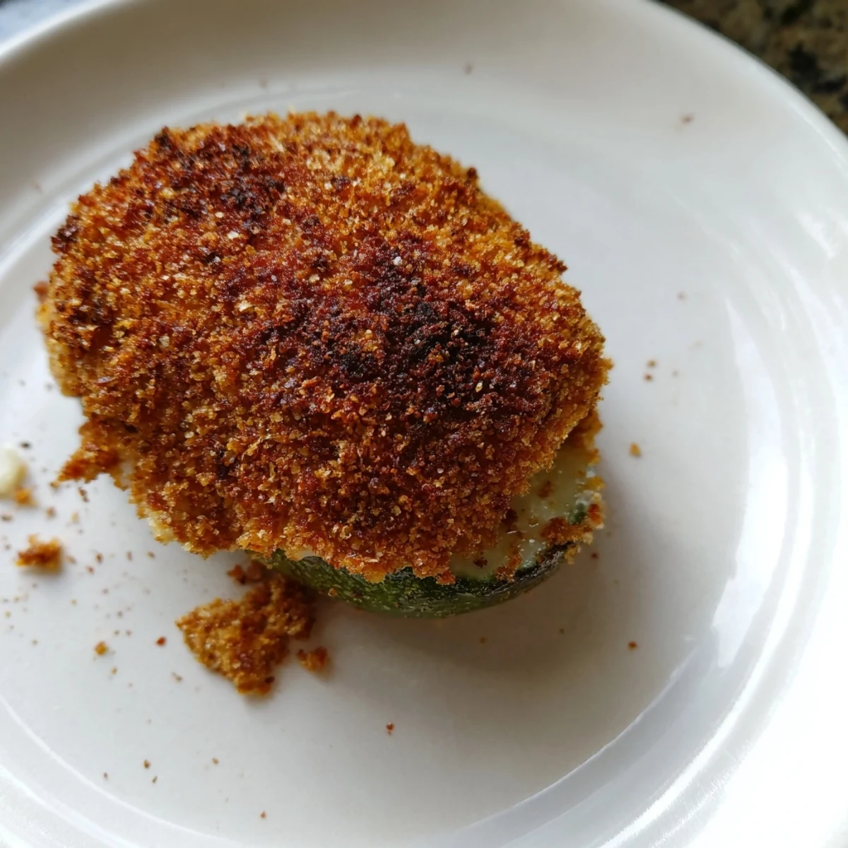 Golden-brown, crispy cheese-wrapped pickle ornaments, ready to enjoy as a flavorful, festive appetizer.