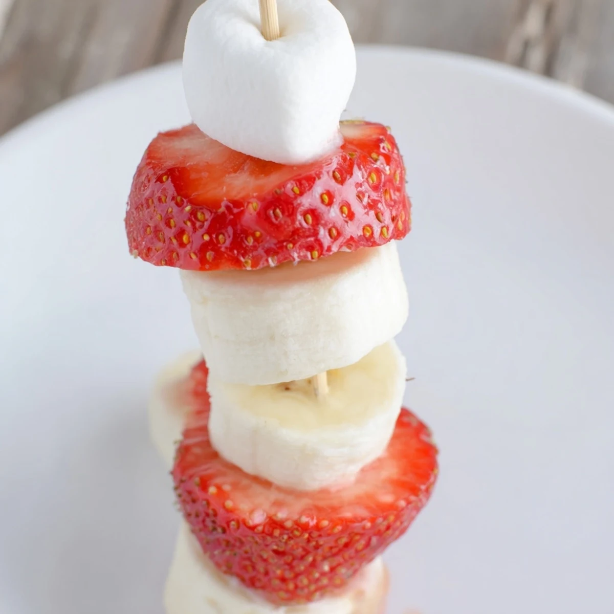 Vibrant photo showing fresh strawberry banana Santa Sticks, perfect for a fun, kid-friendly Christmas treat.