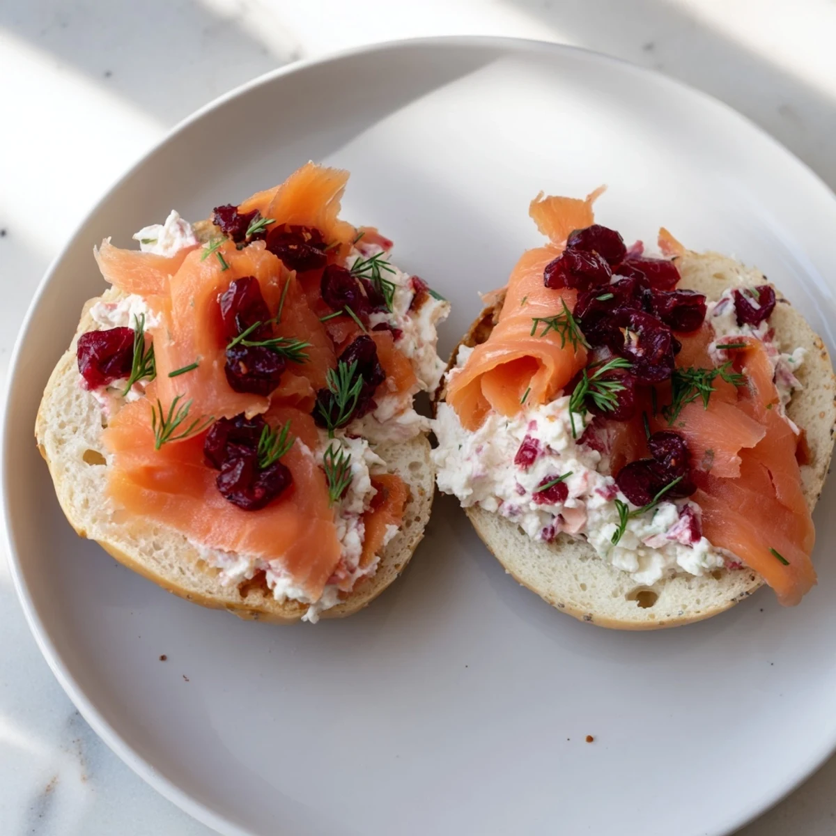 Festive Cranberry Sleigh Bagel Board, a delightful brunch platter with cranberry bagels, cream cheese, and seasonal decorations.