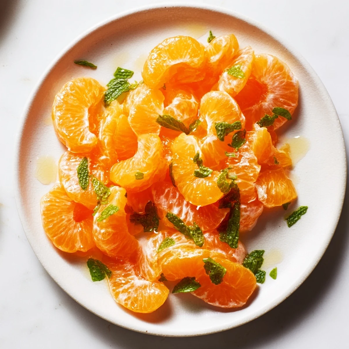 This winter fruit salad presents juicy clementine segments tossed with fragrant mint for a light treat.
