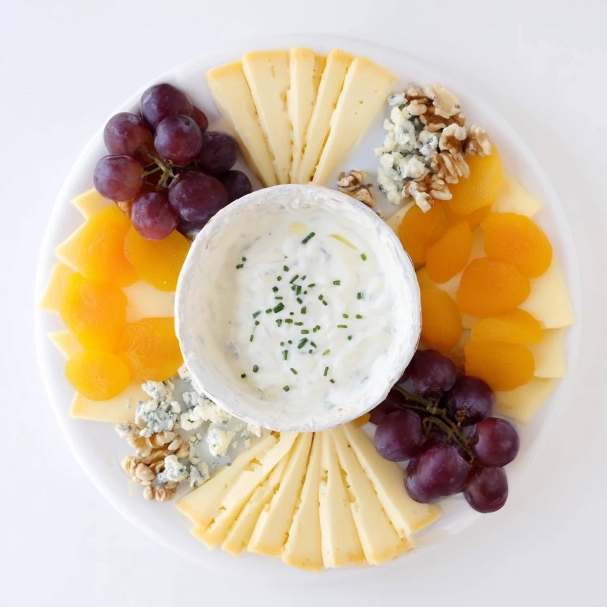 Enjoy a delicious Celtic Cross Cheese Platter featuring creamy brie, sharp cheddar, and walnuts.