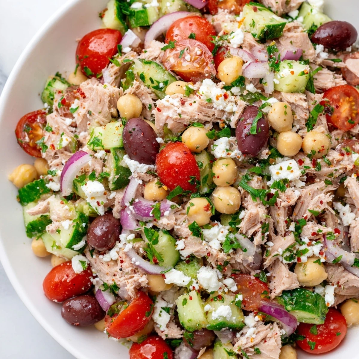 This Tuna Chickpea Salad showcases flaky tuna and creamy chickpeas, tossed in zesty lemon dressing.