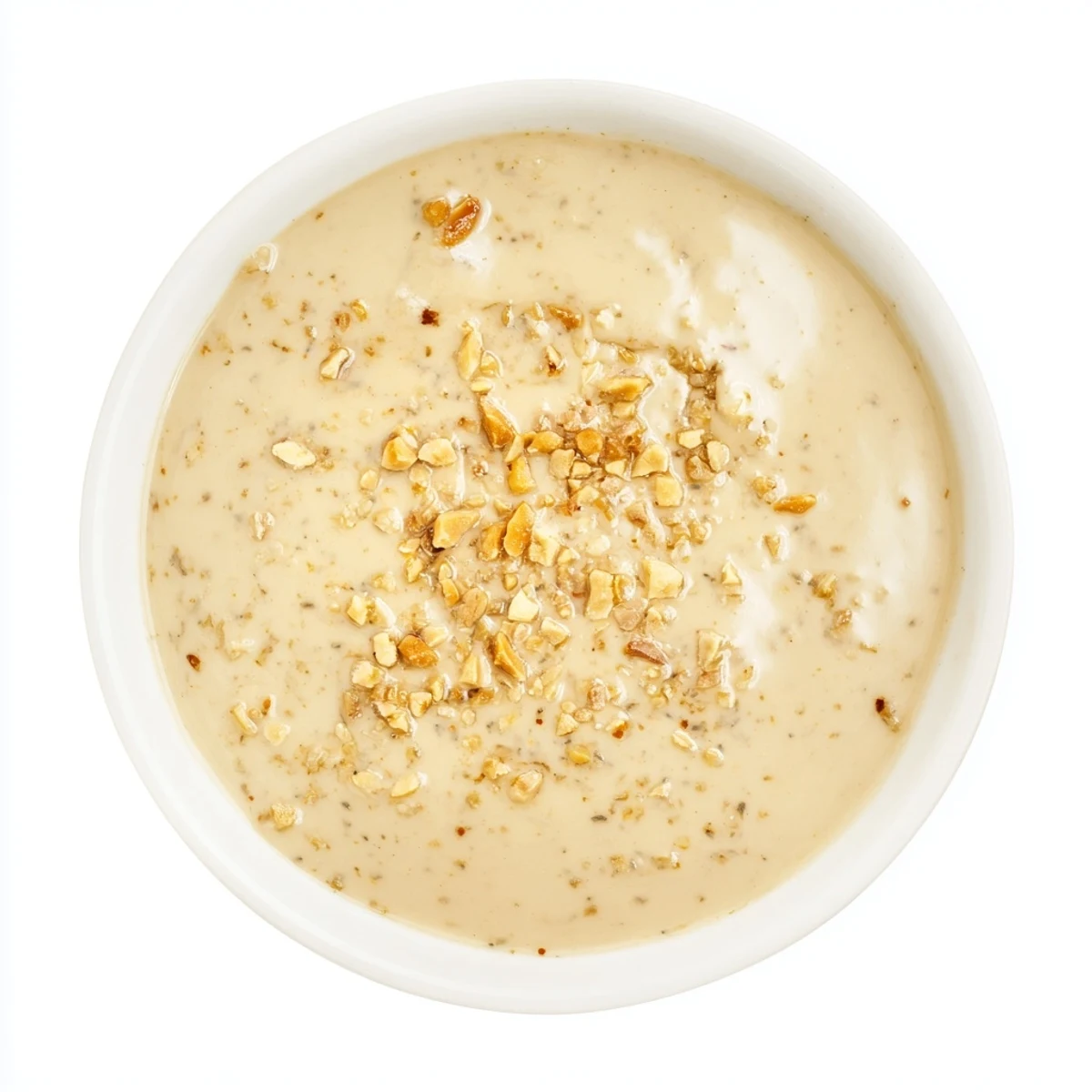 A close-up of vibrant Indonesian Satay Sauce, showing peanut butter's texture and lime fragrance.