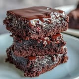 Fudgy sourdough brownies featuring three types of chocolate and tangy discard, baked to chewy perfection in a square pan.  
