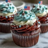 Deliciously decorated Star-Spangled Banner Cupcakes, ready for your Fourth of July party.