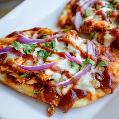 BBQ Chicken Flatbread: A close-up of a golden, cheesy flatbread, ready to be sliced and enjoyed.