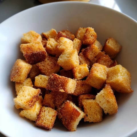 Golden, crispy French Toast Cereal, cinnamon-sugar coated and ready to eat with milk.