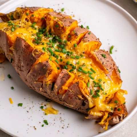 Mouthwatering Sweet Potato & Cheese Whole Roast, the soft sweet potatoes filled with melted, gooey cheese.