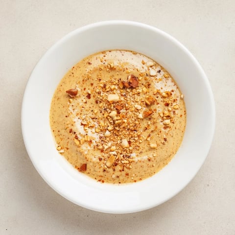 Creamy Indonesian Satay Sauce, perfect with grilled chicken or beef, looks thick and rich.