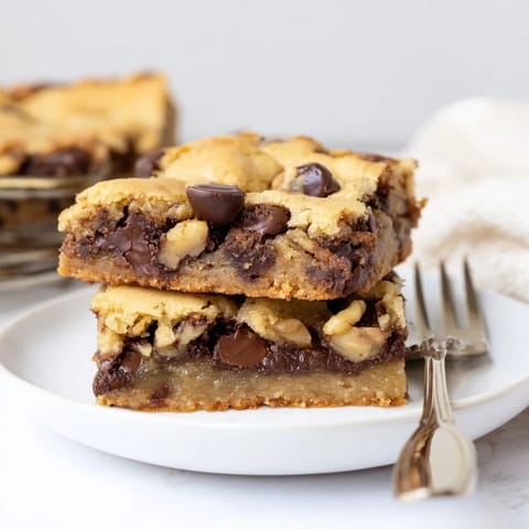 Delicious gooey chocolate chip cookie bars, perfect for a cozy dessert night.  
