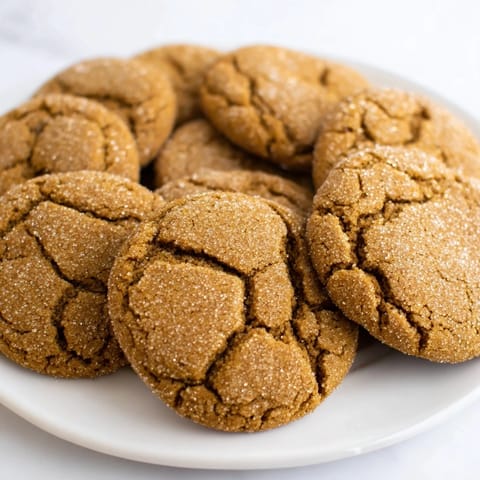 Close-up of soft, chewy Molasses Ginger Cookies, perfect for holiday gatherings and cozy evenings.  