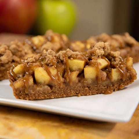 Freshly baked Caramel Apple Cookie Bars with a gooey caramel layer, ideal for sharing with friends.