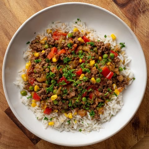 Tender ground beef cooked with rice and fresh veggies in this flavorful Ground Beef Skillet!