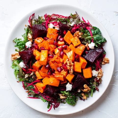 This delicious Hot Girl Winter Salad shows a medley of roasted vegetables and fresh greens, drizzled with dressing.