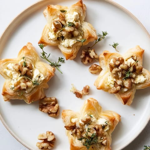 Vibrant arrangement of Starry Night New Years Appetizers, including blueberry brie crostini, sparkling with gold.