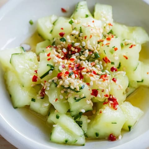 Fresh Cucumber Shaker salad featuring savory rice vinegar and MSG, ready to refresh with crispness.