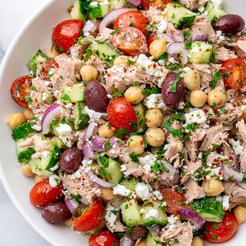 This Tuna Chickpea Salad showcases flaky tuna and creamy chickpeas, tossed in zesty lemon dressing.