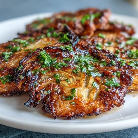 Crispy Air Fryer Cabbage Steaks topped with savory garlic butter for a flavorful vegetarian side dish that's quick and easy.  
