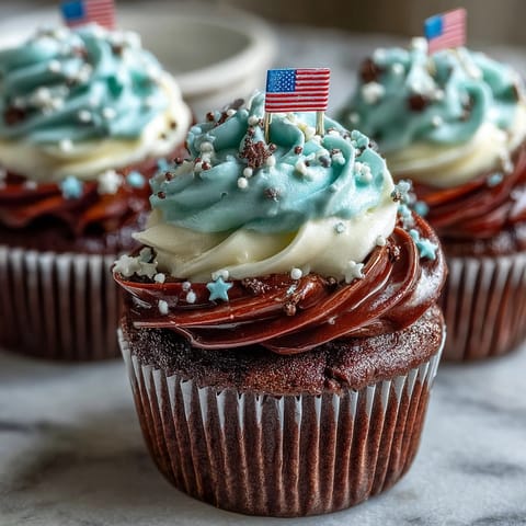 Deliciously decorated Star-Spangled Banner Cupcakes, ready for your Fourth of July party.