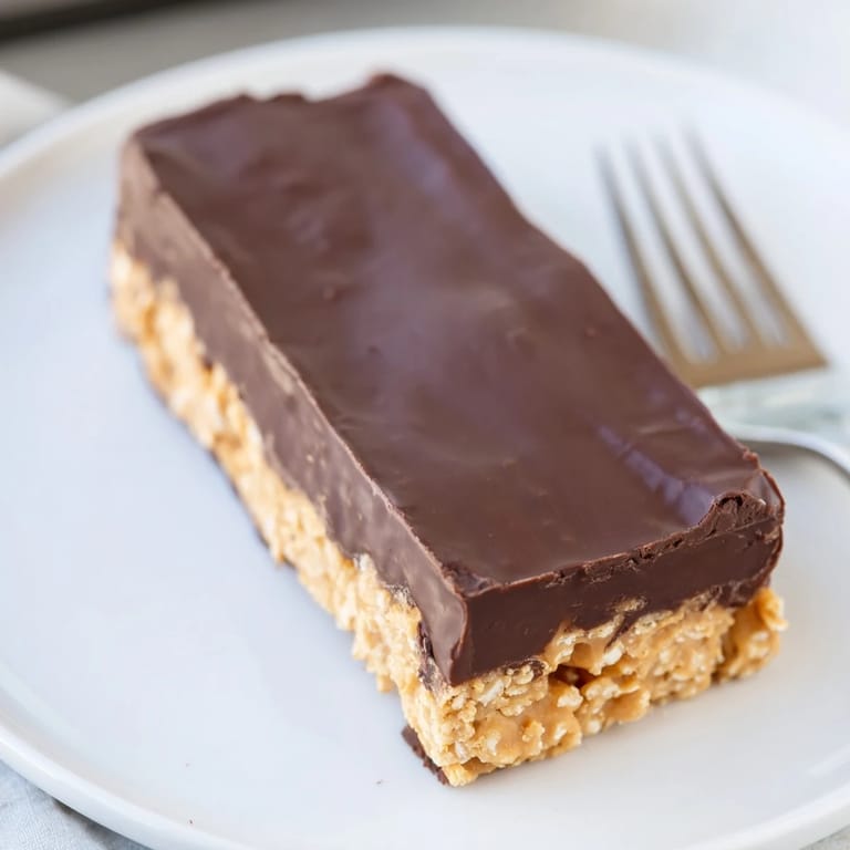 Decadent layers of no-bake peanut butter chocolate bars topped with smooth creamy chocolate.  