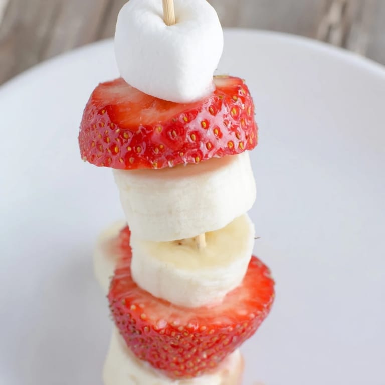 Vibrant photo showing fresh strawberry banana Santa Sticks, perfect for a fun, kid-friendly Christmas treat.