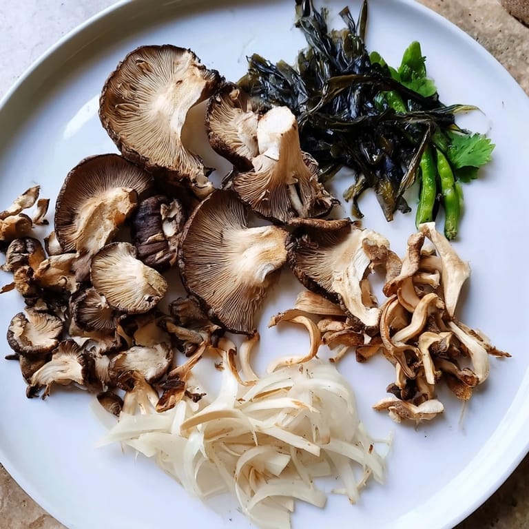 Savor the earthy mushrooms in this Umami Bomb Asian Delight, alongside seaweed and flavorful dipping sauces.