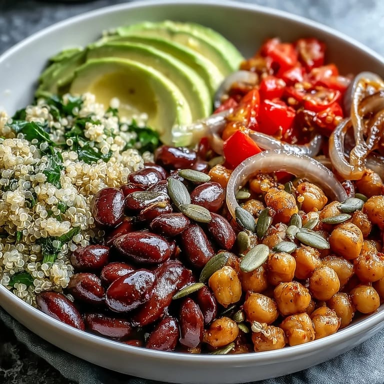 Colorful Three-Bean Power Bowl with kidney beans, chickpeas, and black beans, ready to enjoy as a protein-packed vegetarian dinner.