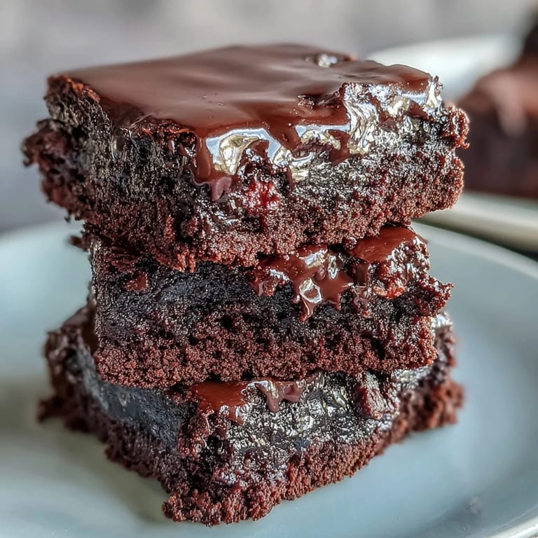Fudgy sourdough brownies featuring three types of chocolate and tangy discard, baked to chewy perfection in a square pan.  